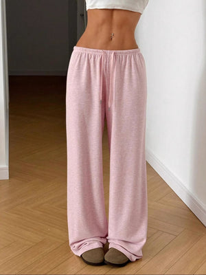 Blush pink casual wide-leg drawstring maternity pants with a relaxed fit.