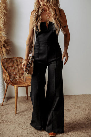 Black structured flare jumpsuit with plunging neckline and wide legs.