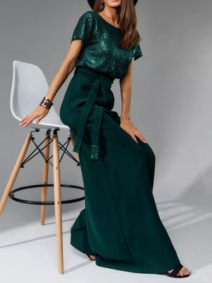 Dark green sequin bodice and palazzo pant ensemble with a tie waist.