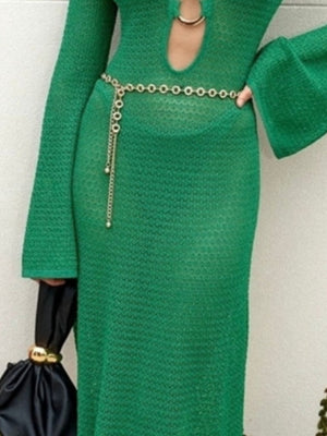 Green knit maxi dress with keyhole neckline and bell sleeves, cinched with a chain belt.