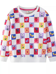 Baby sweatshirt with multicolor checkered pattern of strawberries, flowers, and butterflies.