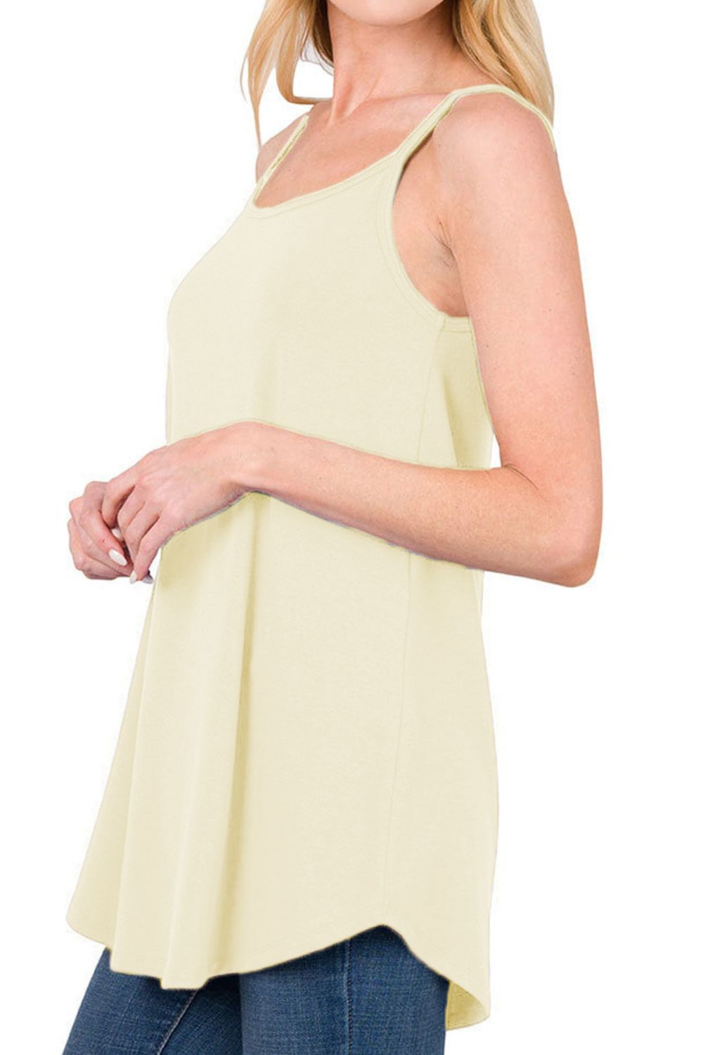 Ivory cami with spaghetti straps and curved hemline