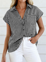Black gingham print button-down shirt with short sleeves and a V-neckline.