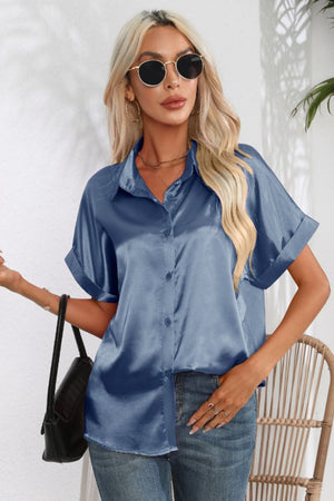 Light blue satin cuffed sleeve button-down blouse with a relaxed fit.