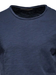 Textured slub cotton crewneck tee in navy, showing fabric texture and neckline detail.