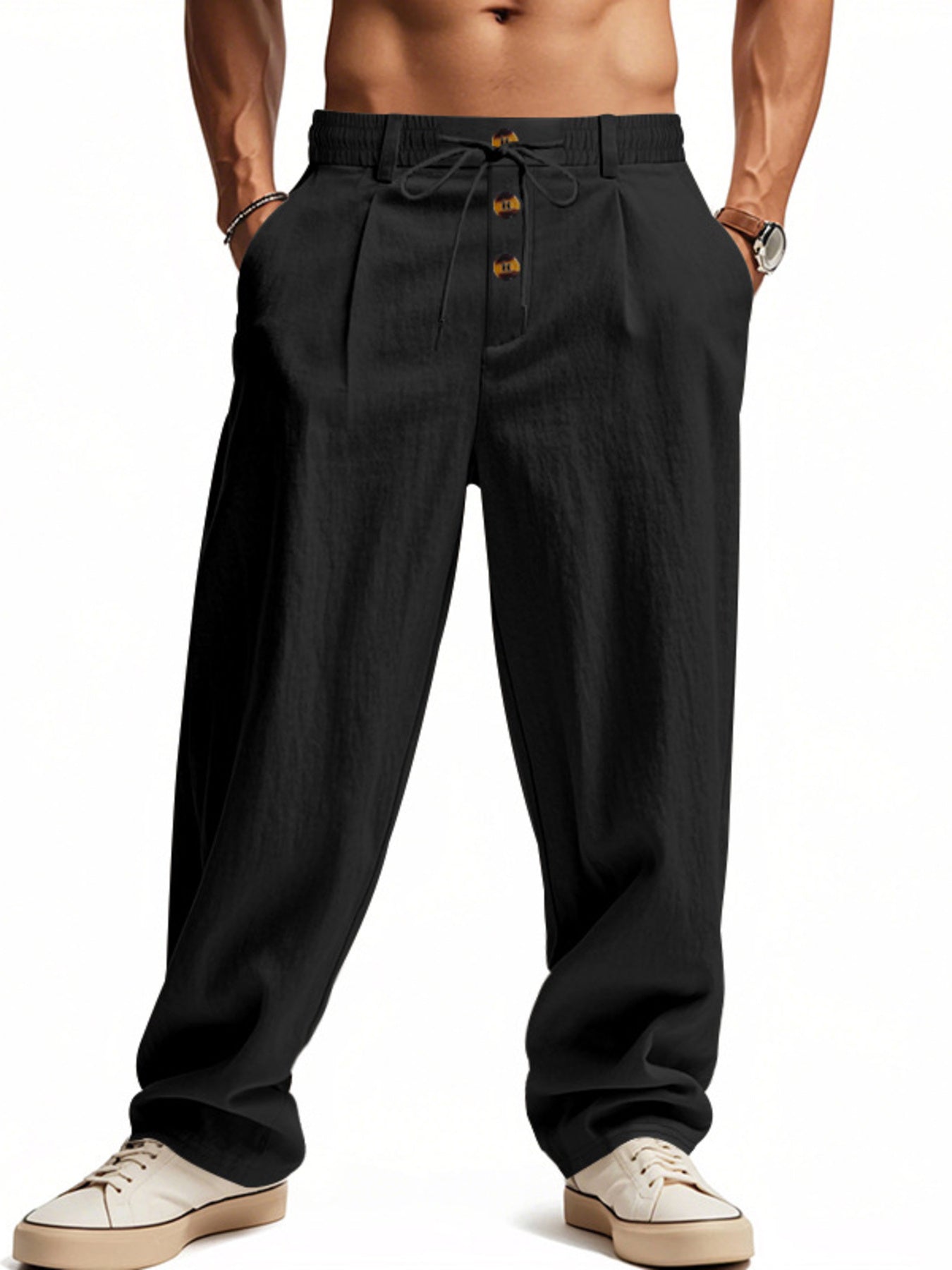 Black drawstring loose fit sweatpants with button detail and pleats.