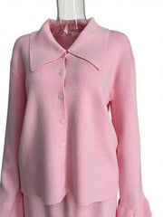 Pink ribbed knit cardigan with collar and button-down front, paired with matching skirt.