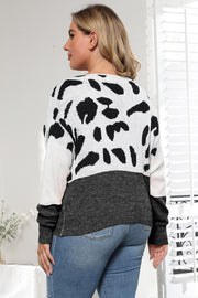 Dalmatian print colorblock knit sweater with black and white pattern and charcoal grey bottom.