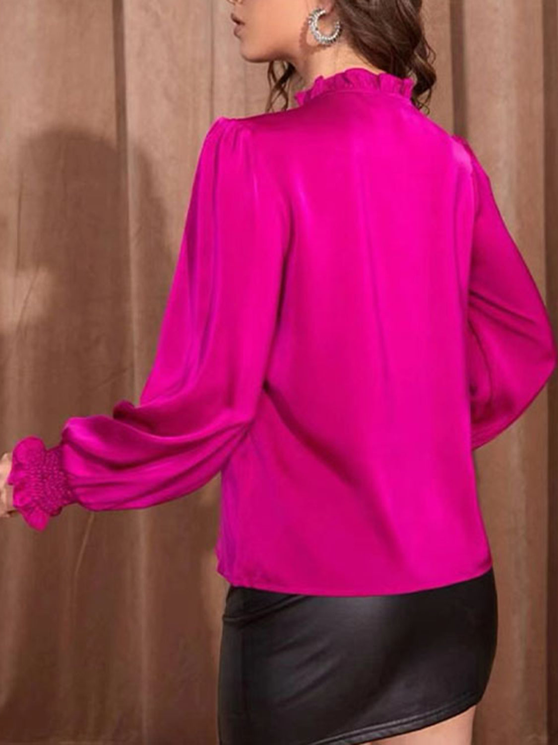 Hot Pink tie-neck blouse with shirred cuffs and ruffled neckline.