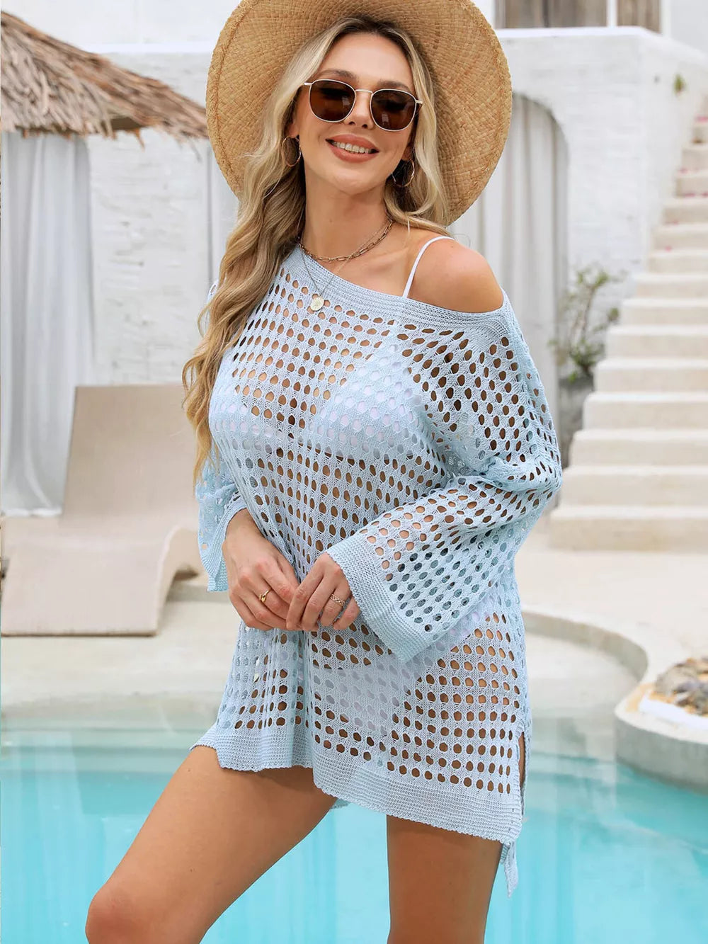 Light blue openwork crochet knit swim cover-up with crew neck and long sleeves.