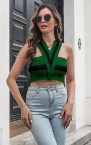 Dark green knit crop top with black stripes and cross straps.