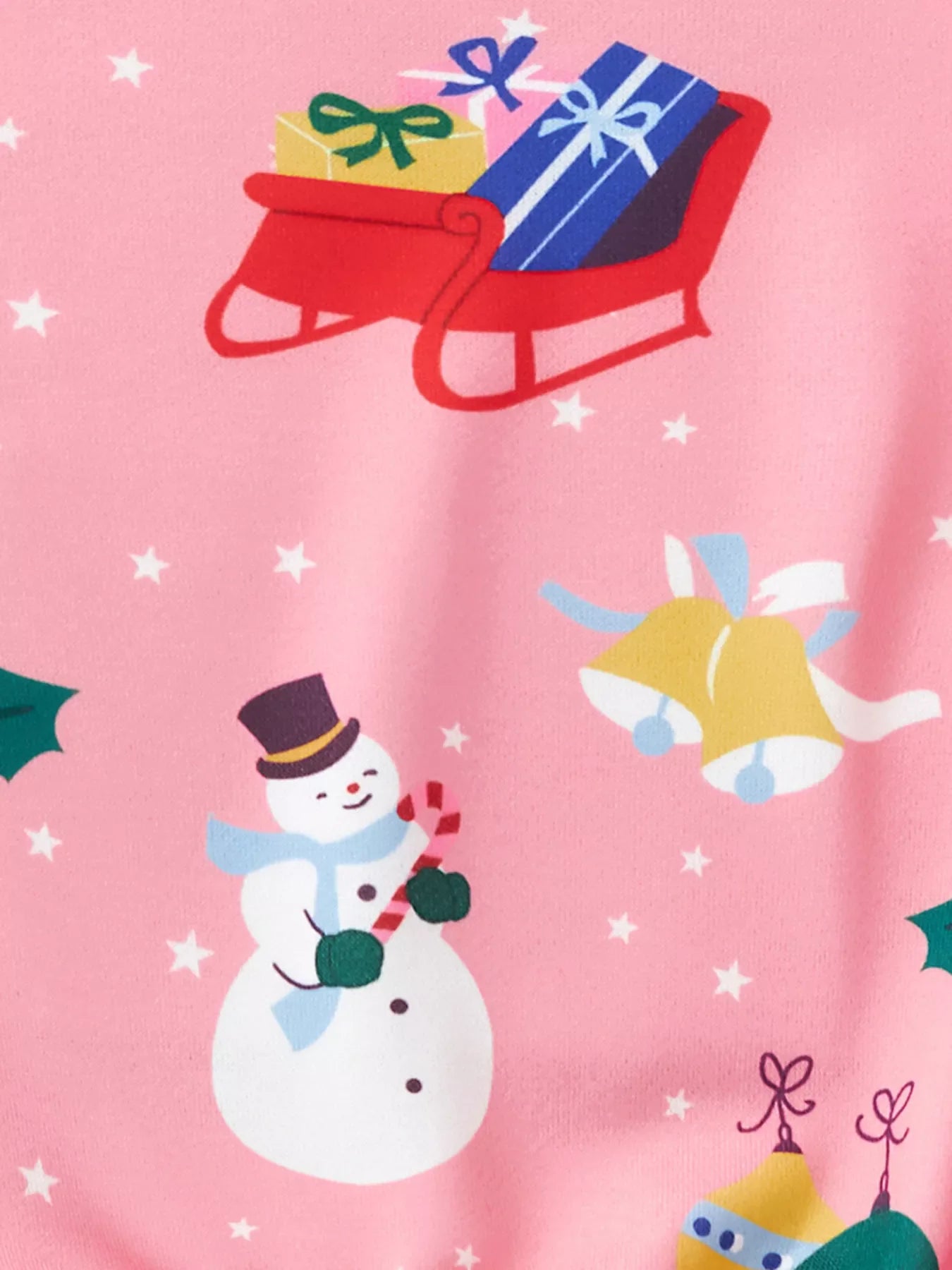 Pink crew neck sweatshirt with festive Christmas print of snowman, sleigh, and bells.