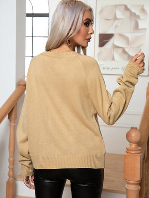 Khaki acrylic cable knit raglan sleeve pullover sweater with crew neck and ribbed cuffs.
