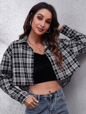 Checkerboard cropped shirt jacket in black and white plaid with button front and collar.