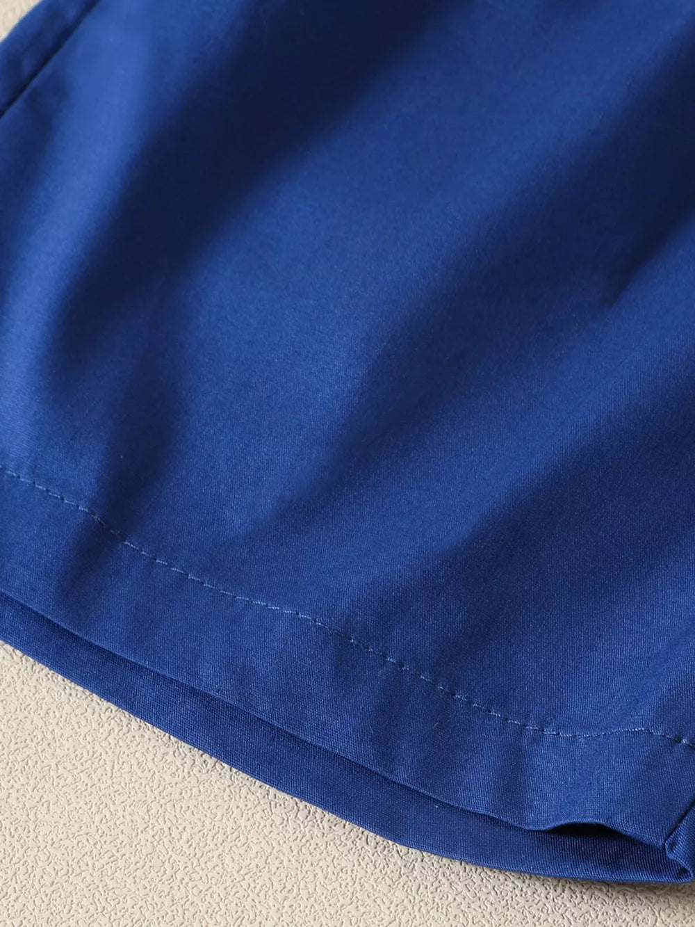 Blue cotton baby shorts with visible stitching detail