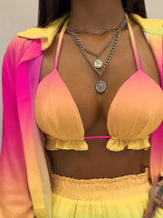 Two-piece outfit set with ruffled trim bikini top and ombre button-up shirt.