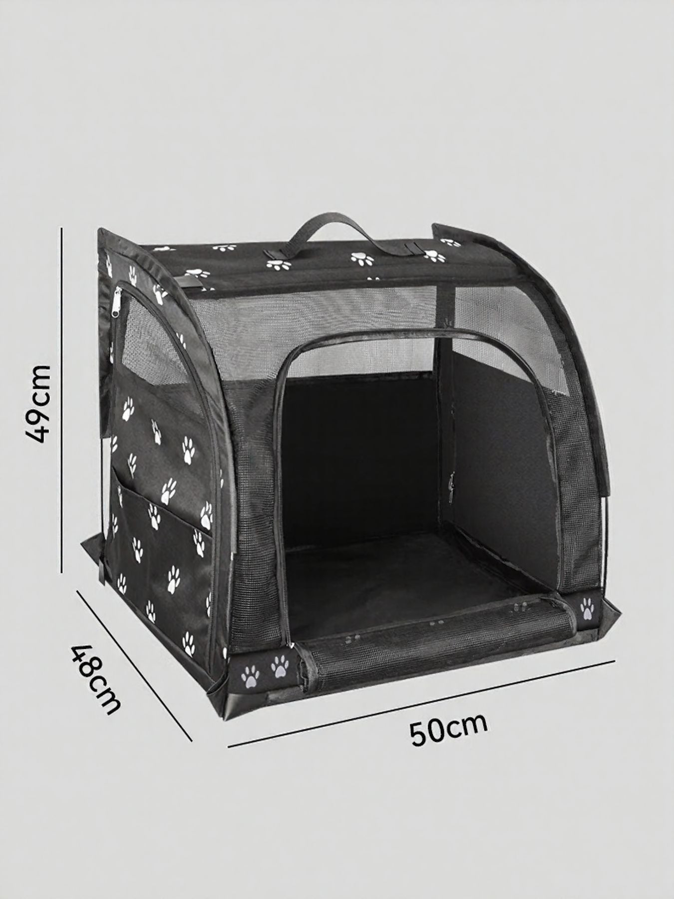 Black pet carrier with white paw print pattern, mesh sides and top, and zippered front opening.