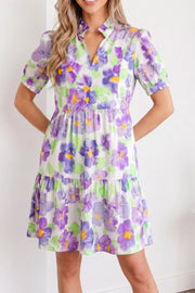 Mini dress with purple floral print, ruffled tiers, and puff sleeves.