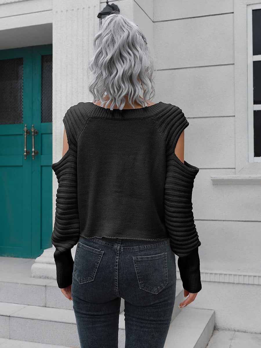 Black ribbed knit cold shoulder sweater with long sleeves.