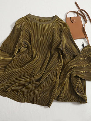 Olive green pleated two-piece set with a round neck top and wide-leg pants.