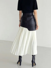 Black leather asymmetric midi skirt with white pleated fabric detail