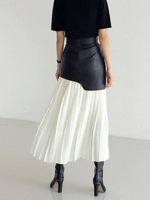 Black leather asymmetric midi skirt with white pleated fabric detail
