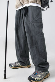 Dark gray technical fabric cargo pants with belt and pockets