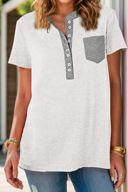 White henley t-shirt with grey contrast collar, buttons, and patch pocket.