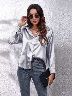 Silken button-down shirt in light gray with a relaxed fit, collared neckline, and button closures.