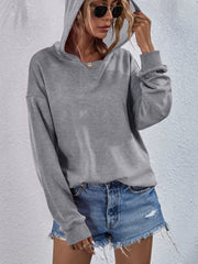 Heather gray hooded sweatshirt with split neckline and relaxed fit