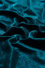 Gathered velvet henley blouse in deep teal with soft draping.