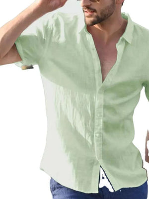 Light green linen resort shirt with short sleeves and open collar, relaxed fit.
