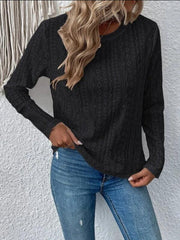 Black geometric eyelet long sleeve knit top with crew neck.