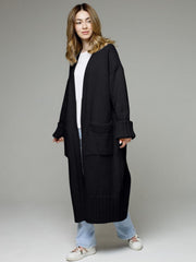 Black oversized ribbed-trim maxi cardigan with pockets and cuffed sleeves.
