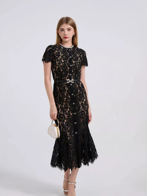 Black floral lace mermaid dress with short sleeves, pearl neckline, and jeweled belt.