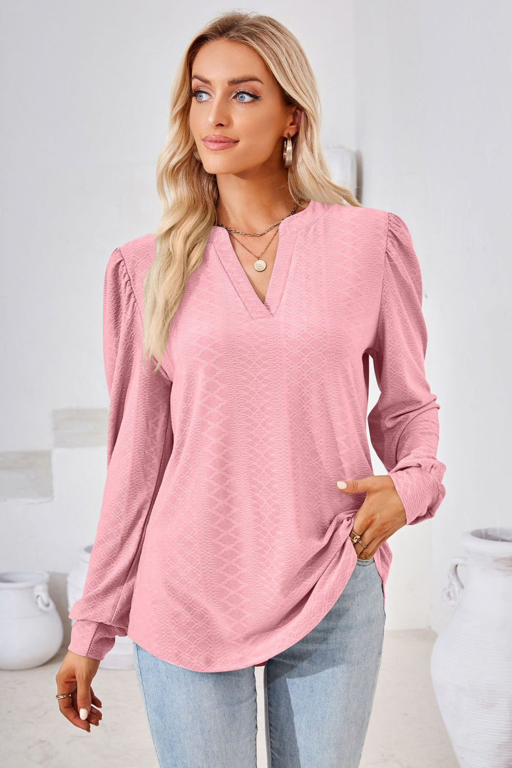 Pink textured blouse with bishop sleeves and v-neck