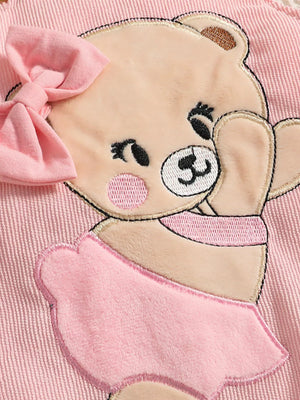 Pink baby bodysuit with a plush bear applique wearing a pink bow and skirt.