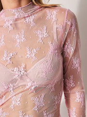 Blush pink floral lace illusion mock neck blouse with long sleeves.