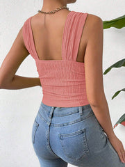 Textured crinkle strap crop top in coral with ruched detail.