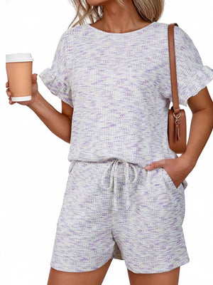 Ruffled sleeve two-piece set in white with purple marled pattern, drawstring shorts.