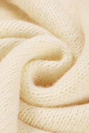 Cream acrylic knit sweater with a textured stitch detail.