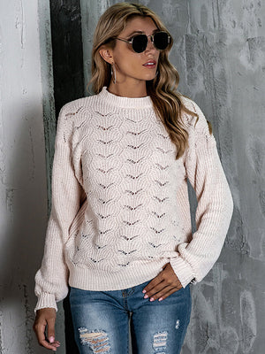 Blush pink openwork knit crew neck pullover sweater with balloon sleeves.