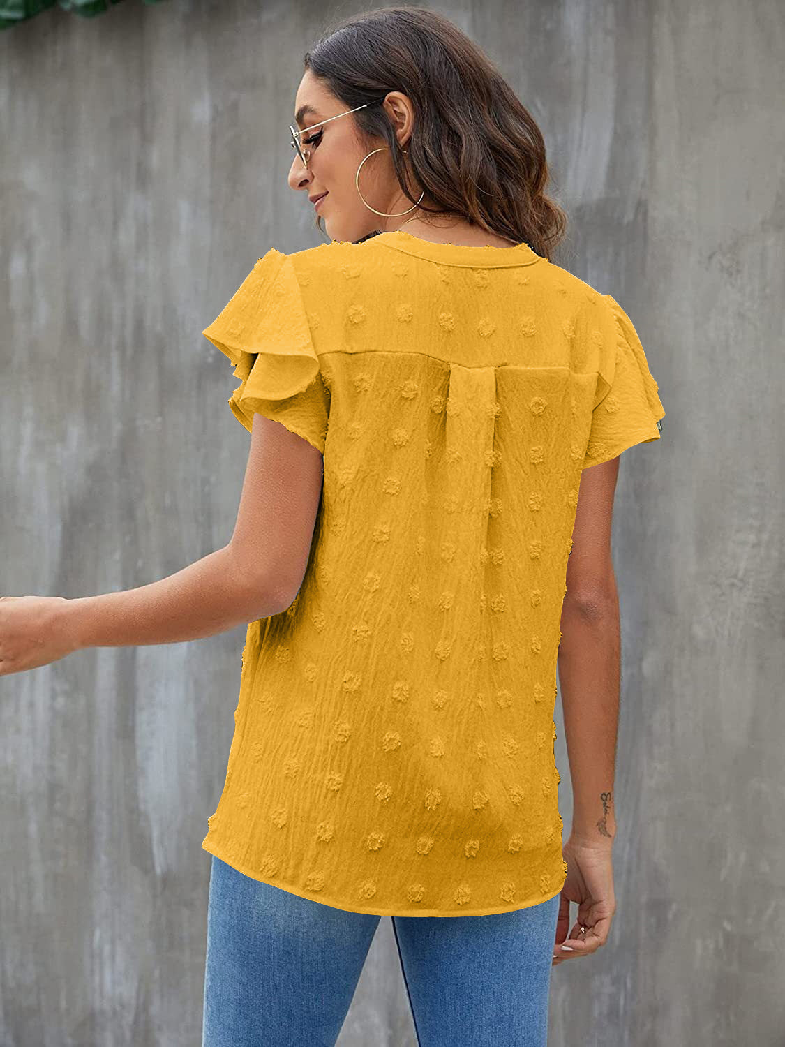 Textured voile blouse in gold with flutter sleeves and a dotted pattern.