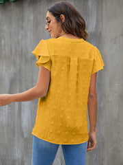Textured voile blouse in gold with flutter sleeves and a dotted pattern.