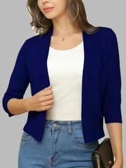 Navy open-front cropped cardigan with elbow sleeves, worn over a white top and jeans.