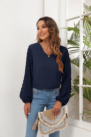 Dark Navy V-neck blouse with textured pom-pom balloon sleeves.