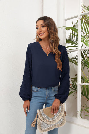 Dark Navy V-neck blouse with textured pom-pom balloon sleeves.