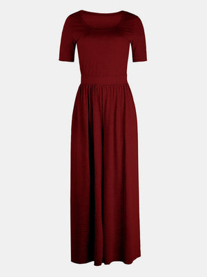 Burgundy textured wide-leg maternity jumpsuit with short sleeves and subtle elastic waist