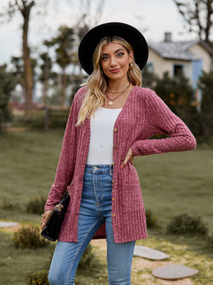 Longline ribbed knit button-down cardigan in a dusty rose color with two front pockets.