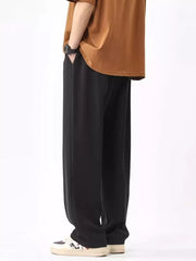 Men's black wide leg sweatpants with drawstring waist and pockets.
